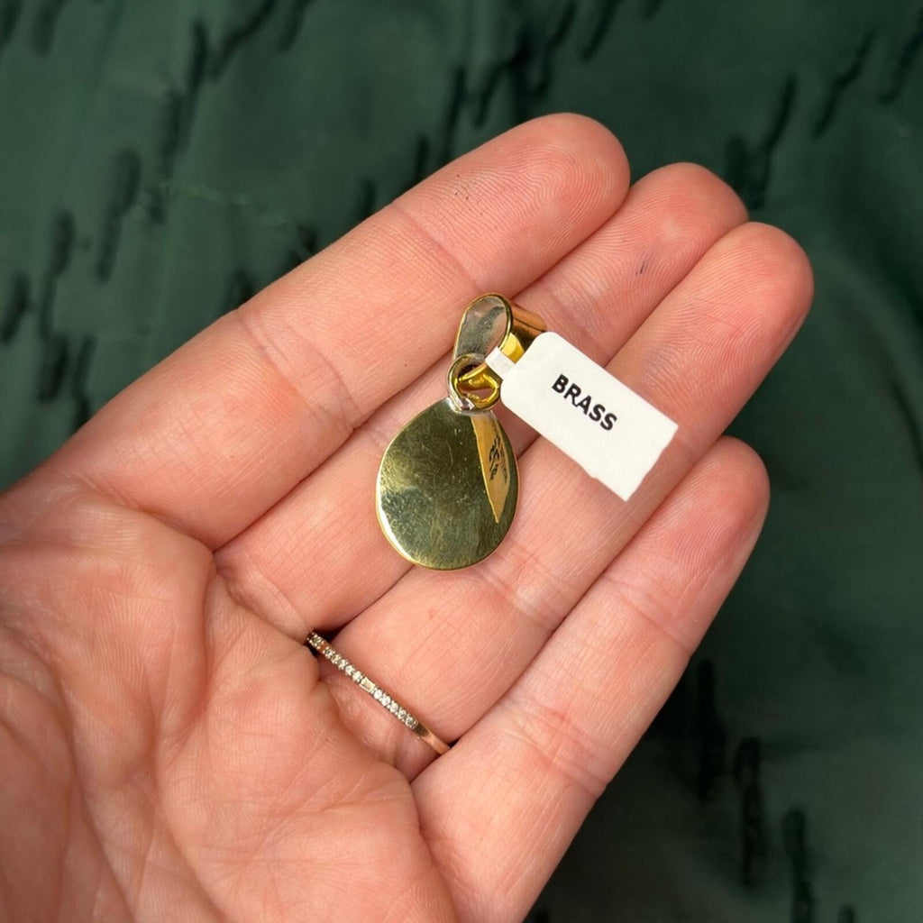 White Buffalo Brass Pendant