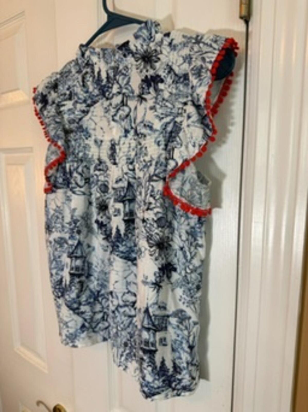 Sleeveless Printed Blouse with Ruffle and Red Trim Detail