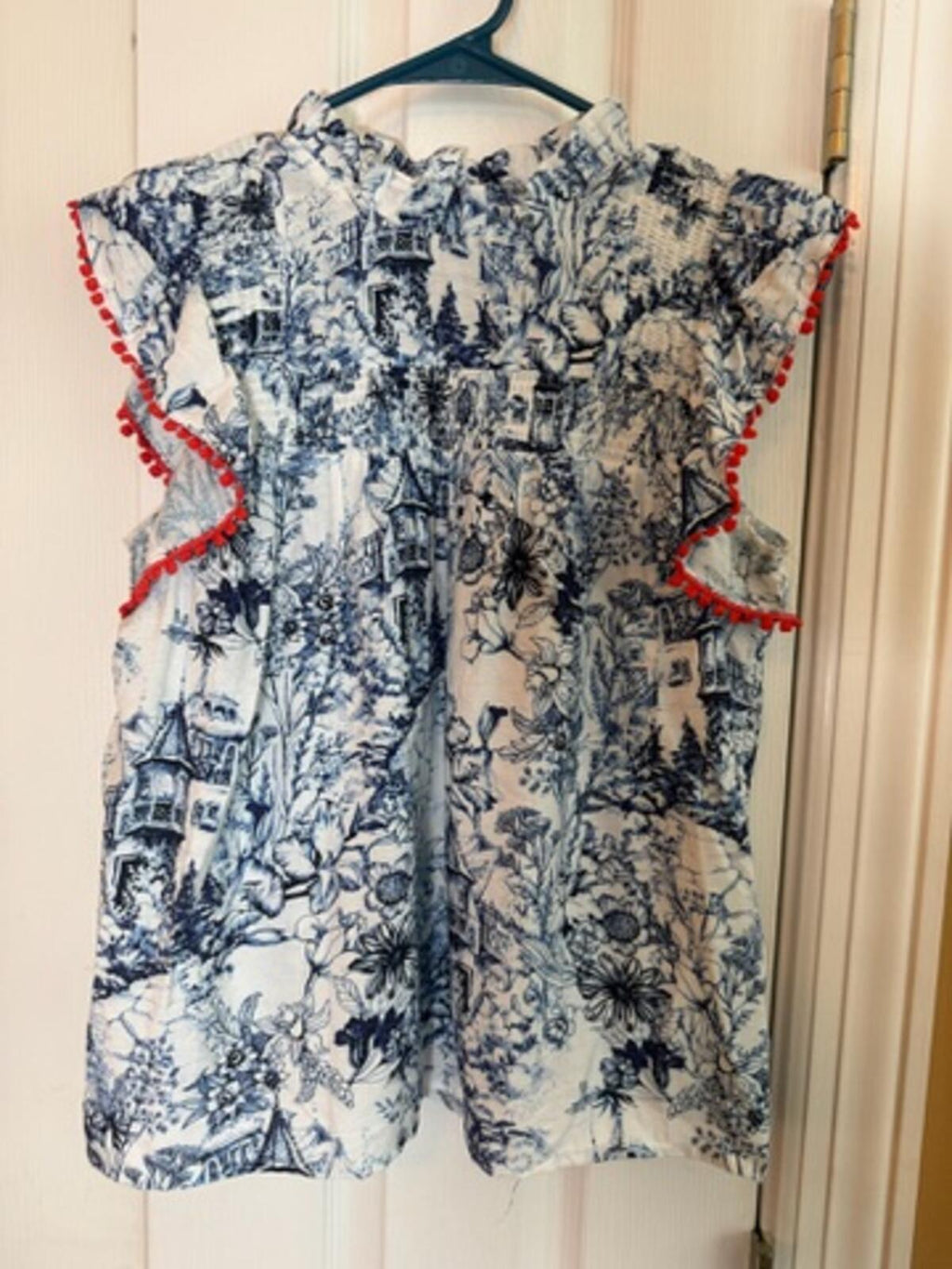 Sleeveless Printed Blouse with Ruffle and Red Trim Detail